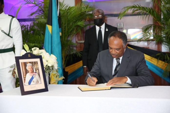 Grand Bahama Officials Sign The Book Of Condolence On The Passing Of HM 